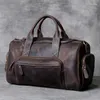 Duffel Bags Horse Duurzame gekke lederen mannen vrouwen reizen retro hoogwaardige grande hand duffle cowhide Boston schoudertas