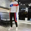 メンズトラックスーツ2023年の夏のスポーツとレジャースーツ韓国スタイルのファッション服クールワイルドズボンの衣料品人