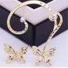 Kolczyki stadnonowe HCYP Fashion Cynk Stop Sprzedawanie biżuterii słodkie Wyolbrzymione Wykwintne kryształowy asymetryczny motyl