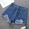Kvinnors shorts sommar denim för kvinnor koreanska hög midja mångsidiga studenter lösa hål visar tunna a-line byxor trend