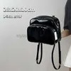 Bolsos de hombro Diseño de nicho Mochila pequeña para mujer Bolso de hombro para estudiante de niña de charol Bolso de viaje para mujer de color sólido lindocon estilobolsos de mano