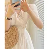 Robes décontractées 2023 été Style coréen niche fée jupe français rétro boucle conception manches bouffantes robe blanche