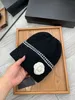 New fashion solid color flower couple knitted hat Harajuku style all thin woolen hat autumn and winter baotou warm melon skin hat male cold hat female