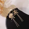 Boucles d'oreilles pendantes strass pour femmes mode coréenne personnalité géométrie nœud papillon femme à la mode marée bijoux en gros 2023