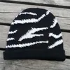 Szerokie czapki wiadra luksusowy zimowy kapelusz zebra wzór dzianinowy dla kobiet moda ciepłe czaszki czapka panie swobodne okładki czapki 230801