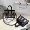 BirkinbagデザイナーバッグBirki Handmade BX Snow House 2023 New Womens Fashion Versatile Leather Cowhide Lock Backle Handheld Color Block