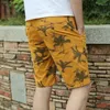 Pantaloncini da uomo 2023 Summer Male Camouflage Pantaloni da spiaggia casual a cinque quarti Versione coreana di tendenza elastica