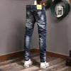 Jeans da uomo Streetwear Moda Uomo Retro Blu Stretch Slim Fit Pantaloni con fori strappati Pantaloni vintage firmati dipinti Hombre