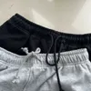 Shorts masculinos etiqueta de pedra puro algodão cor sólida bússola bordada corda e show feminino fino casal solto high street tr 230802