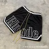 Rhude American High Street Mesh Sports Basketbalshorts Veelzijdige casual strandoutwear Losse capri's voor heren zomer