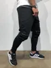 Mäns jeans avslappnade sportbyxor vår och hösten stor storlek ungdom stretch leggings mode koreansk stil blixtlåsfabrik