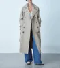 Trench da donna all'inizio dell'autunno prodotto doppio petto moda allentato temperamento tinta unita casual cappotto di media lunghezza