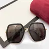 2023 Novos óculos de sol de grife de luxo G Family Moda feminina Óculos de sol poligonais Ni INS Online Vermelho Mesmo ano do porco Edição limitada GG0106s