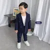 スーツ春秋の子供ダブル胸スーツセット男の子ピュアカラーブレザーパンツ2PCS衣類セットキッズホストパーティーパフォーマンスコスチューム230802