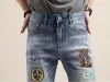 mens jeans men's blue ripped jeans, rock Revival jeans, men's motorcycle jeans. Blue patch , baggy , designer blue jeans guy CHG2308039