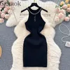 Abiti casual Gagaok American senza maniche Spicy Girls' lavorato a maglia da donna Summer Pure Desire Chain Hollow Out Waist Show Bodycon Vestidos