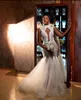 Elegante kant zeemeermin trouwjurk klassieke hoge hals parels Saoedi-Arabische mouwloze bruidsjurk op maat gemaakte vestido de novia