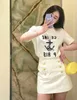 スカートデザイナーShenzhen Nanyou Womens Clothens CEファミリーショートスカート夏の新しいメタルボタン装飾アンチグレアハイウエストAラインEgko