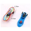 Novelty Games 100 PCSlot Cartoon Finger Skateboard PVC Model Desktop Slide Play Wholesale Kid Gift Toy 230803