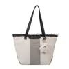 Lona de gran capacidad para las mujeres Otoño Primavera 2023 Nueva moda Commuter Shoulder Tote Simple y de moda Tidestylishhandbagsstore