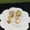 Brass material lion head splicing circular heart pendant lady Charm earrings, designer simple advanced design personalized ear bracket, banquet, party, gift
