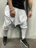 Pantaloni da uomo Pantaloni di tendenza hip-hop europei e americani Piedi in tinta unita Sport di strada Harem casual con coulisse