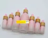 wholesale Flacone contagocce in vetro smerigliato Pipetta a goccia Colore rosa con tappo in bambù Bottiglia di olio essenziale da 1 oz 5 ml 10 ml 20 ml 30 ml 50 ml 100 ml LL