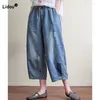 Kvinnors jeans fashionabla lappdesigns vintage elastiska midja 2023 Sommarkläder Lossa all-matchfickor denim Capri Pants