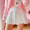 Kjolar kawaii vit ruffle mini kjol kvinnor japansk stil söt lolita bow lapptäcke hög midja sagor kort mori tjej