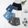 Short jeans feminino cintura alta rasgado curto