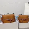 Мужские маленькие затворы Pochette Dual Puzzle Saddle модные сумки роскошные дизайнерские классические мешки с сцеплением поперечного тела женская подлинная кожа 2023 2 размеры сумки для рук на плече