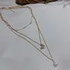 Hänghalsband flerskiktskedja på halsimulerade pärlpärlor bling stjärnklart Clear Crystal Alloy Choker halsband för kvinnor