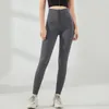 Pantaloni modellanti elastici a vita alta da donna e pantaloni fitness aderenti con bottoni in tinta unita per stringere l'addome
