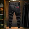 Calça Jeans Masculina Hip Hop Letra Estampada Calças Tornozelo Soltas com Faixas Estilo Ocidental Moda Casual Moda Rua Principal Juventude