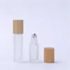 Frasco roll-on de óleo essencial fosco 5ml 10ml tampa de bambu recipiente de perfume de vidro com bola de metal JL1886