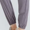 Pieds liés lâches course Sport séchage rapide athlétique Fitness Joggers femmes pantalons de survêtement avec deux poches latérales pantalon d'exercice