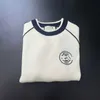女性用Tシャツデザイナーゲーディング衣類Gファミリー23秋/冬の新製品ラウンドネックニットウェアオーバーレイトップコートD9GJ