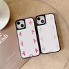 Fundas de teléfono de diseñador de moda para iPhone 14 14Pro Max 14pro 14plus 13promax 13pro 13 12 12Pro Max Flower Letters Funda de cuero de pu de lujo a prueba de golpes Parejas32650