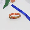 Designer Bangles Armband Kvinnor Läder Arvband Luxury Charm Armband Orange Kvinnor handledsdekoration smycken 18K guldpläterad rostfritt stål