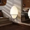 Lampade da terra Lampada di seta a forma di rugby nordico Lampada moderna a vento silenzioso Apparecchio creativo per camera da letto Soggiorno Divano Luce d'angolo a LED decorativa