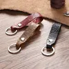 Keychains vintage handgjorda läder kohud rep nyckelring metall snidad mönster nyckel täcker bilring gåva