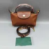 Bag High 2024 quality Clearance Dumpling Wholesale Wholesale Shoulder strap wallet Nylon Short Handle Hand Contrast Cosmetic Cognac Color Hand Mini handbag