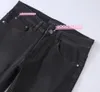 designerskie dżinsy elastyczność dżins hombre spodnie Mężczyźni i kobiety moda luksusowe spodnie dżinsowe sproszone marka marki motocyklowe spodnie męskie przyciski logo 004