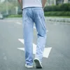 Męskie dżinsy jeansowe mężczyźni dżinsowe spodnie szeroko nogawkowe styl koreański prosty jasnoniebieski worka elastyczna talia studenckie spodnie Mężczyzna
