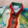 Camicia a maniche lunghe con stampa a olio Casablanca Camicia da taschino per le vacanze al tramonto sul mare T230806