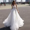 Sexy Illusion-Rücken-Hochzeitskleid, Blumenapplikationen, Spitze, Perlen, Glanz-Hochzeitskleid für die Braut, Perlen Bling-Brautkleid