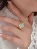 2023 Novo anel feminino micro embutido europeu e americano em forma de ovo com incorporação de diamante de sentido avançado para roupas de mão elegantes