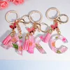 Pink Dry Flower 26 Initial A To Z Resin Keychain With Butterfly Tassel Pendant Shiny Keyring for Women Girl Handbag Accessories