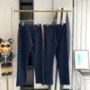 2023 MENS Women Designer Pants Gu Spodni Sprężynowe letnia wstążki Unisex Wysokiej jakości spodnie Rozmiar S-XL