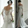 Koreańska koronka boho i satynowa sukienka ślubna A seksowna spaghetti z boku podzielone długie rękawy eleganckie sukienki ślubne proste gorset z kości słoniowej ro300x